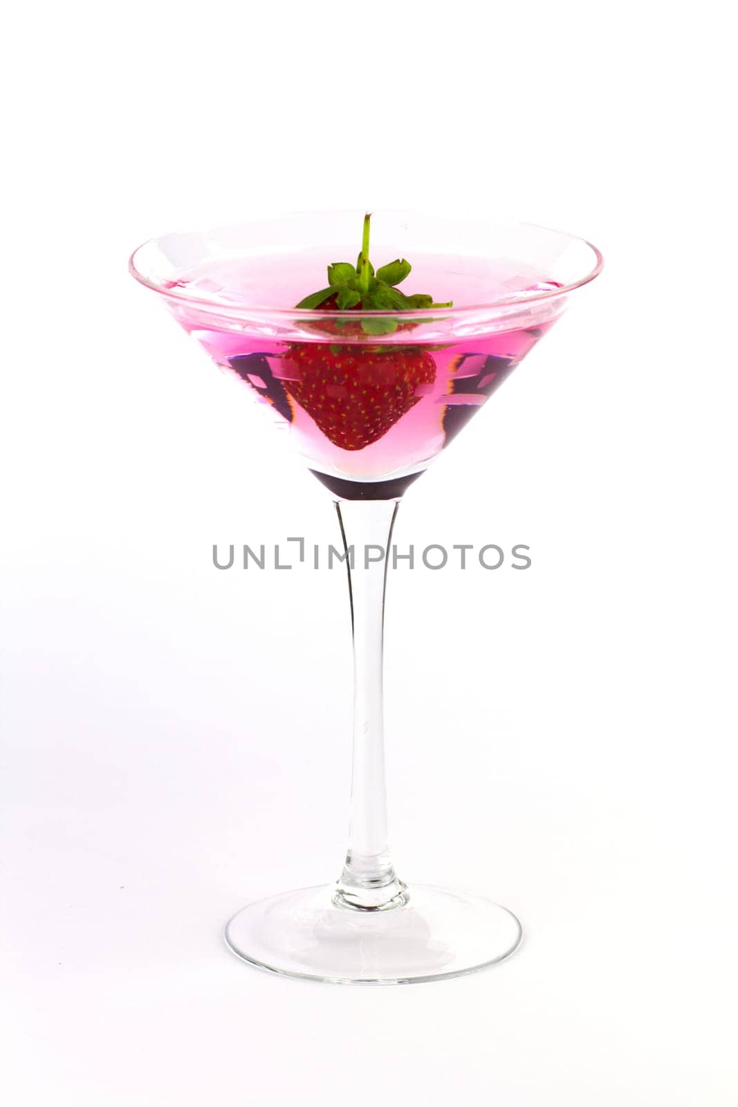 A pink martini garnished with a strawberry