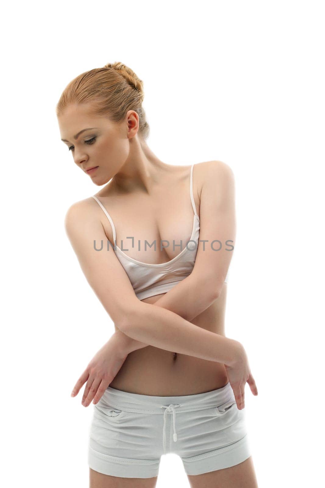 Young girl in dance cloth training on white isolated