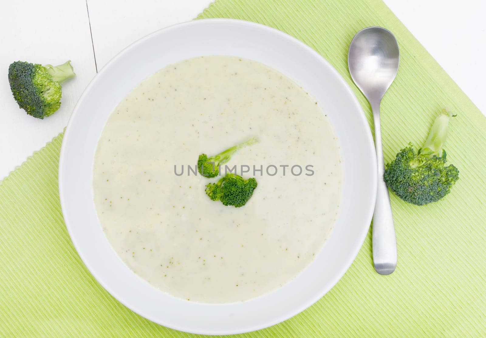 White Bowl of Cream or  Broccoli Soup on Green