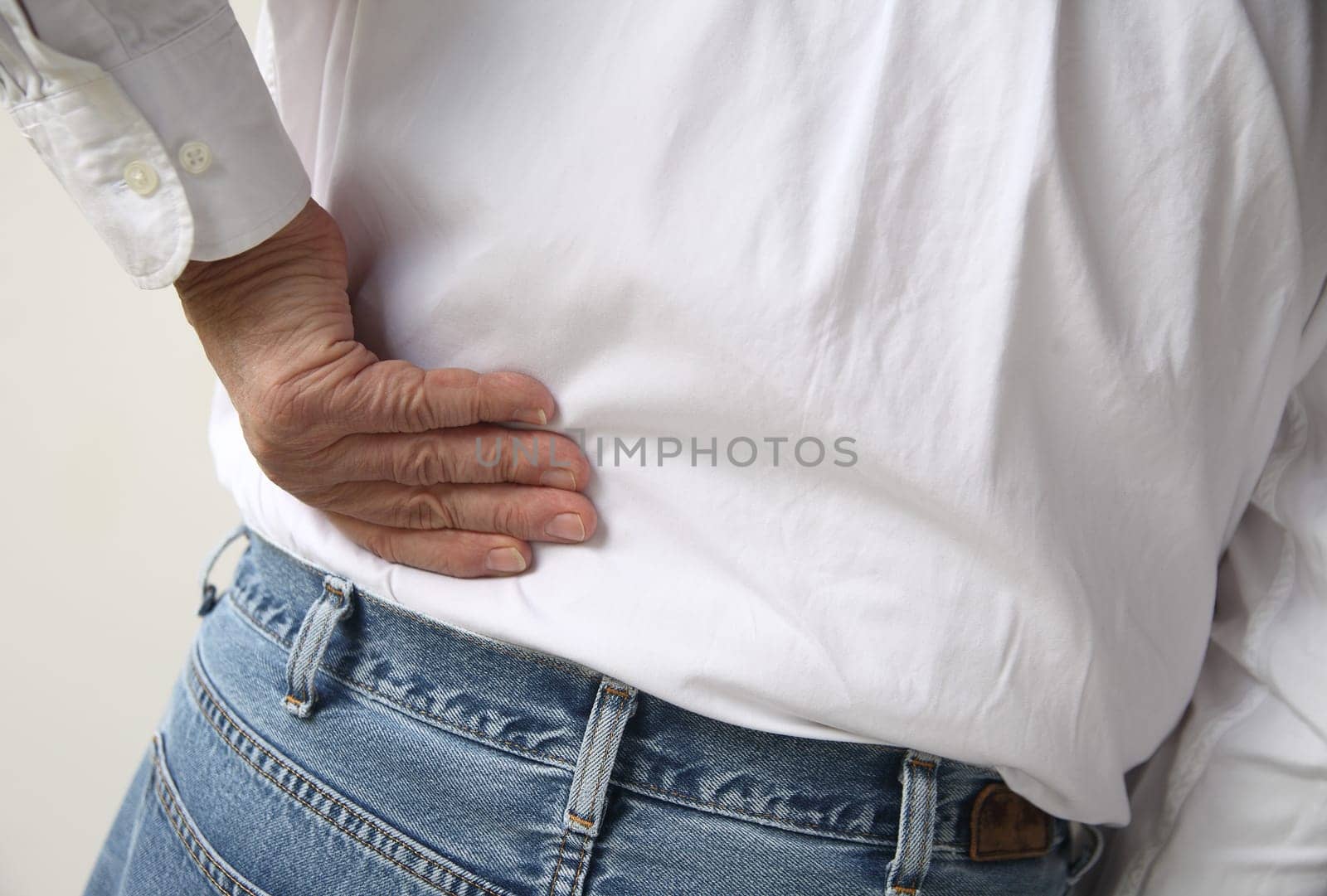 a man with a hand on his back