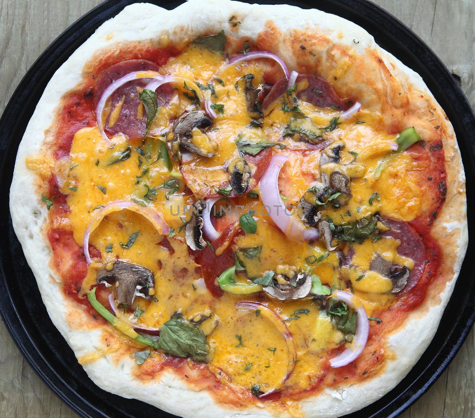 a homemade pizza with assorted ingredients