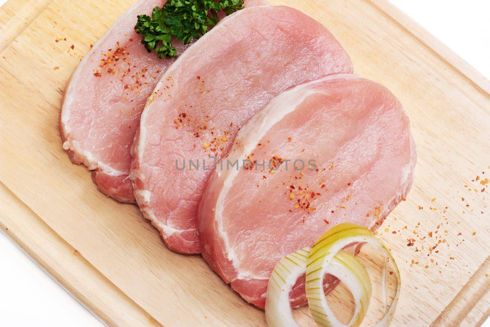 Fresh slices of pork isolated on white