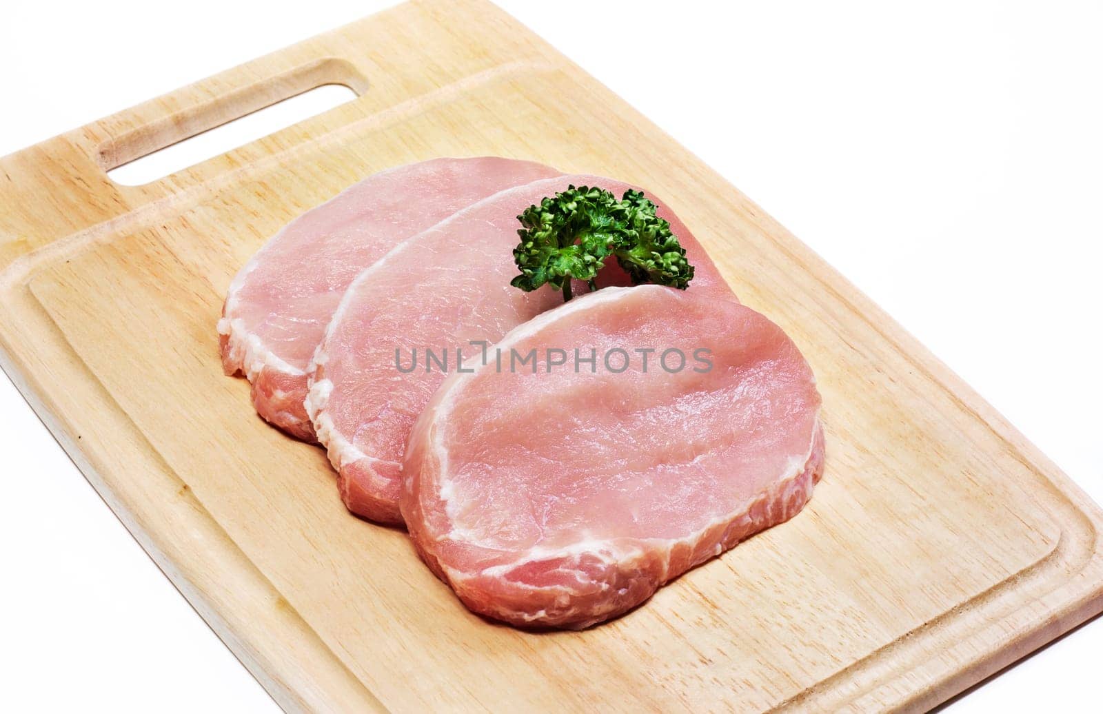 Fresh slices of pork isolated on white