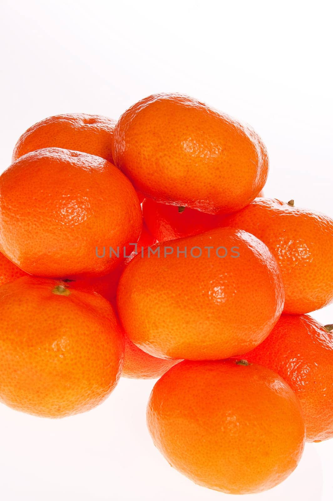 Ripe tangerines on white background