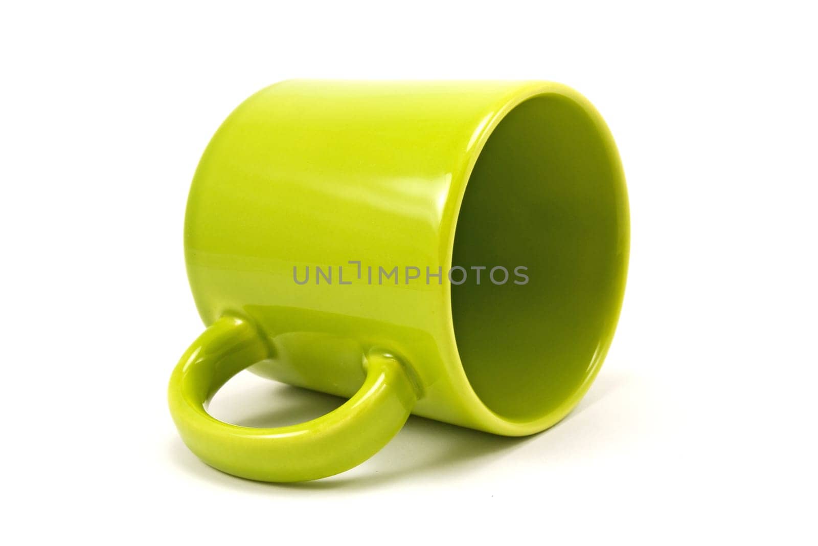 green teacup isolated on a white background