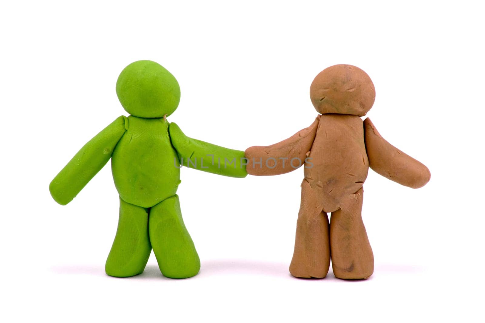 two friends made from plasticine over white background
