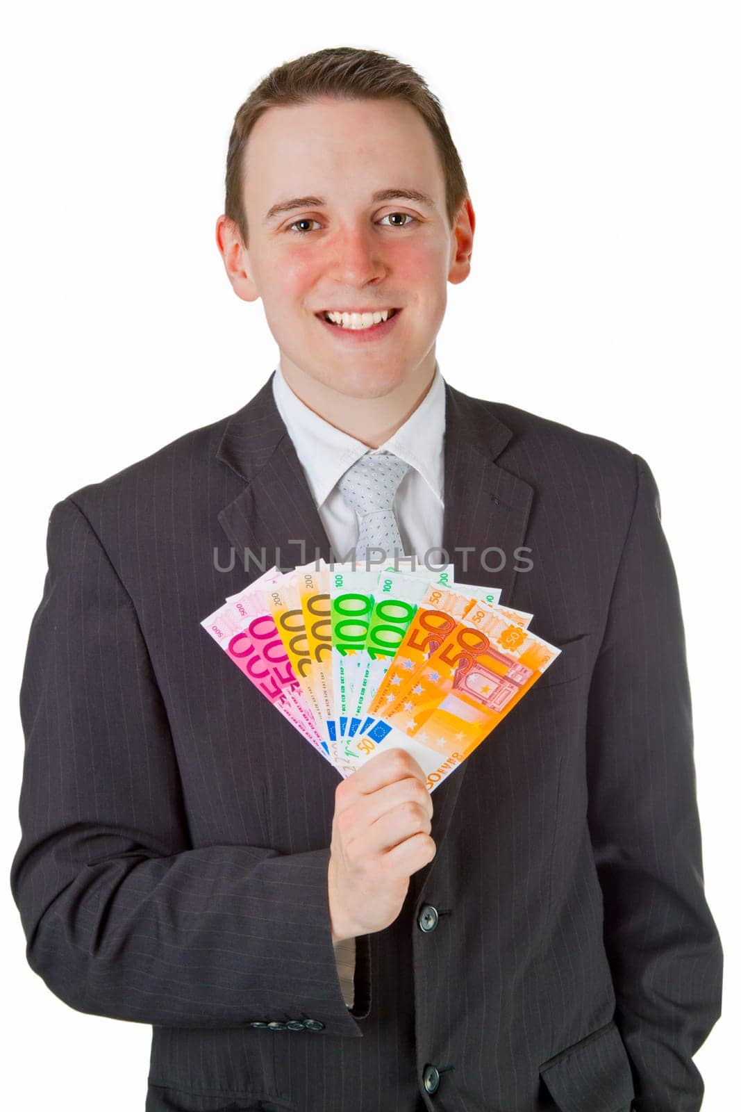Young businessman with banknotes isolated on white background