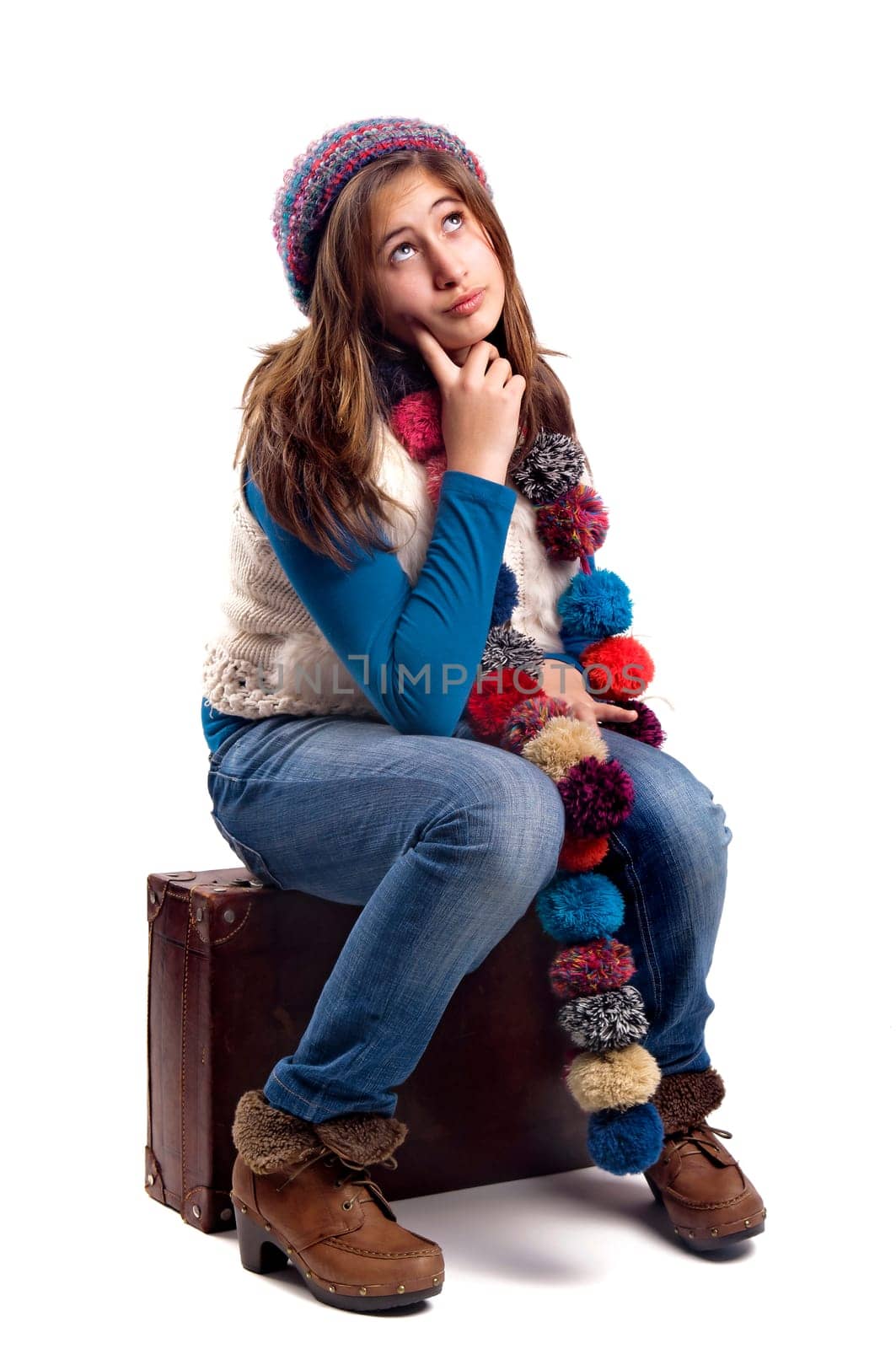 Beautiful young girl posing with case isolated in white