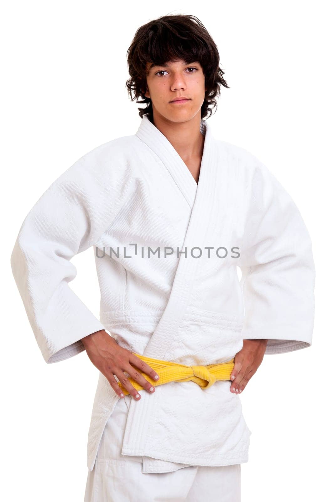 Young fighter posing against a white background