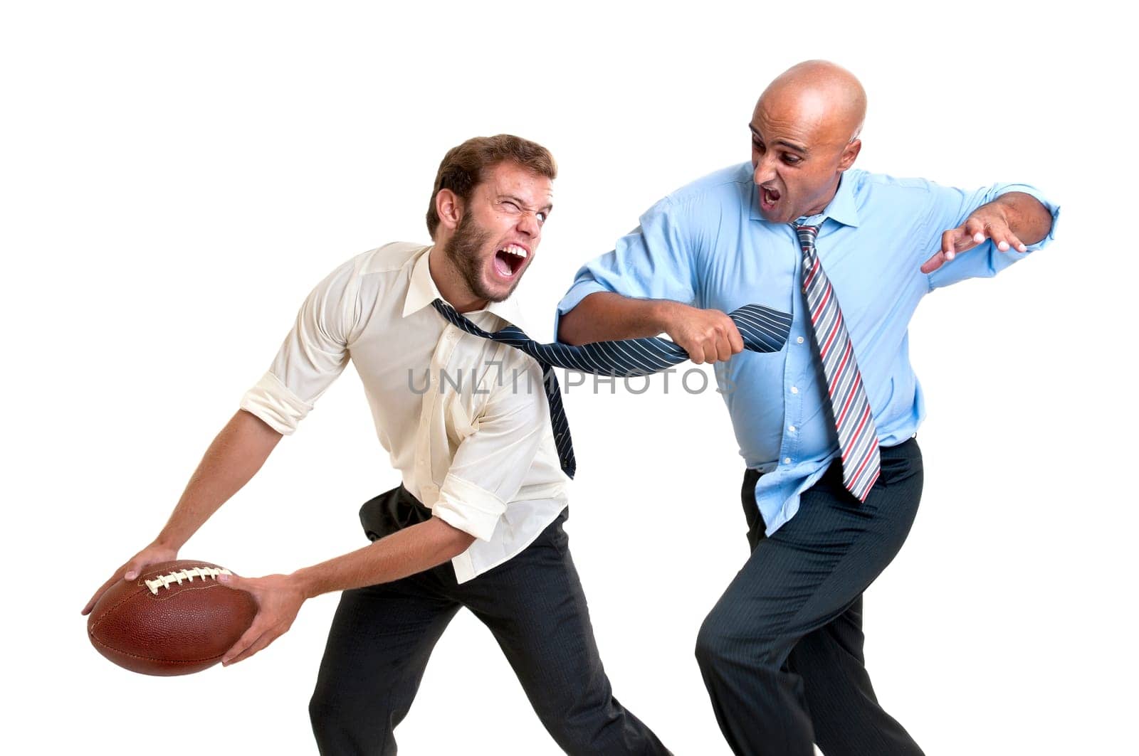 Businessmen playing rugby isolated in white