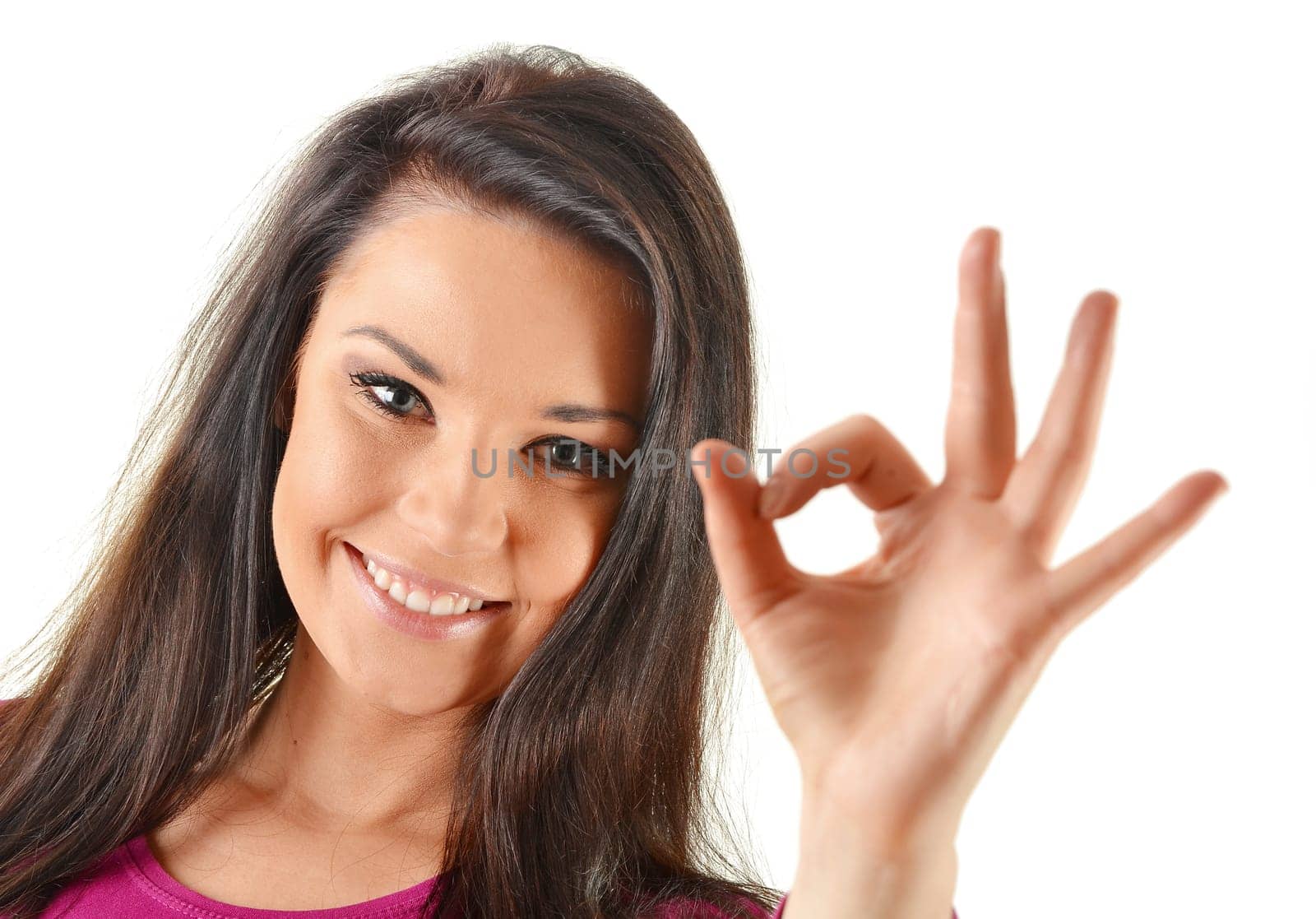 Young attractive woman showing ok isoleated on white