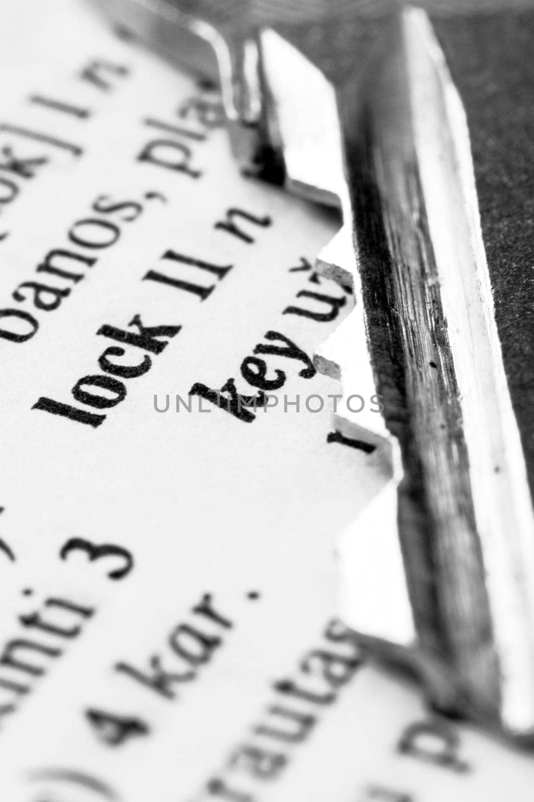 close-up of a key placed onto dictionary