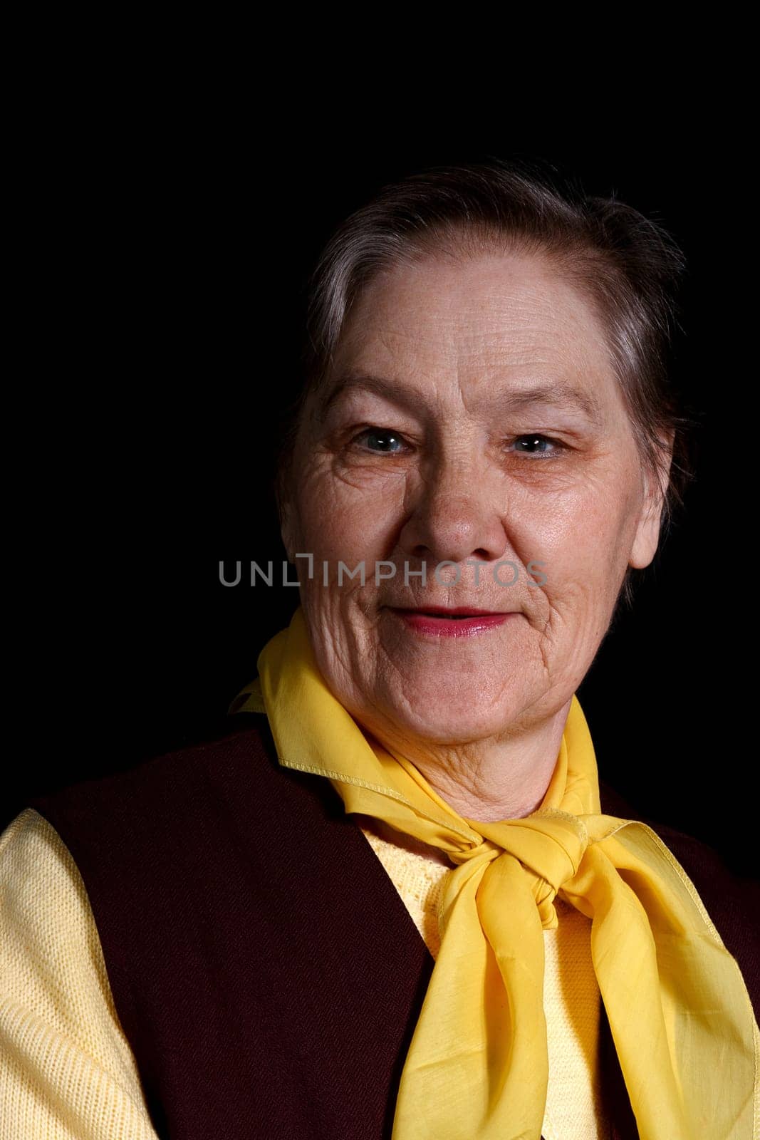 smiling old woman portrait on a black background
