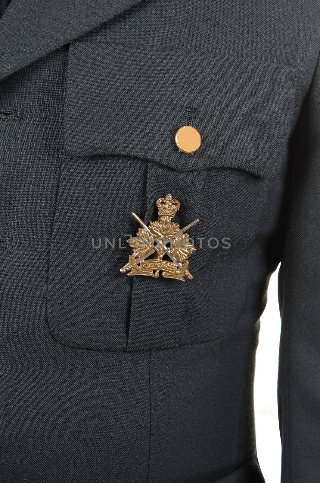 A closeup of a olive green uniform jacket with a medal on the pocket.