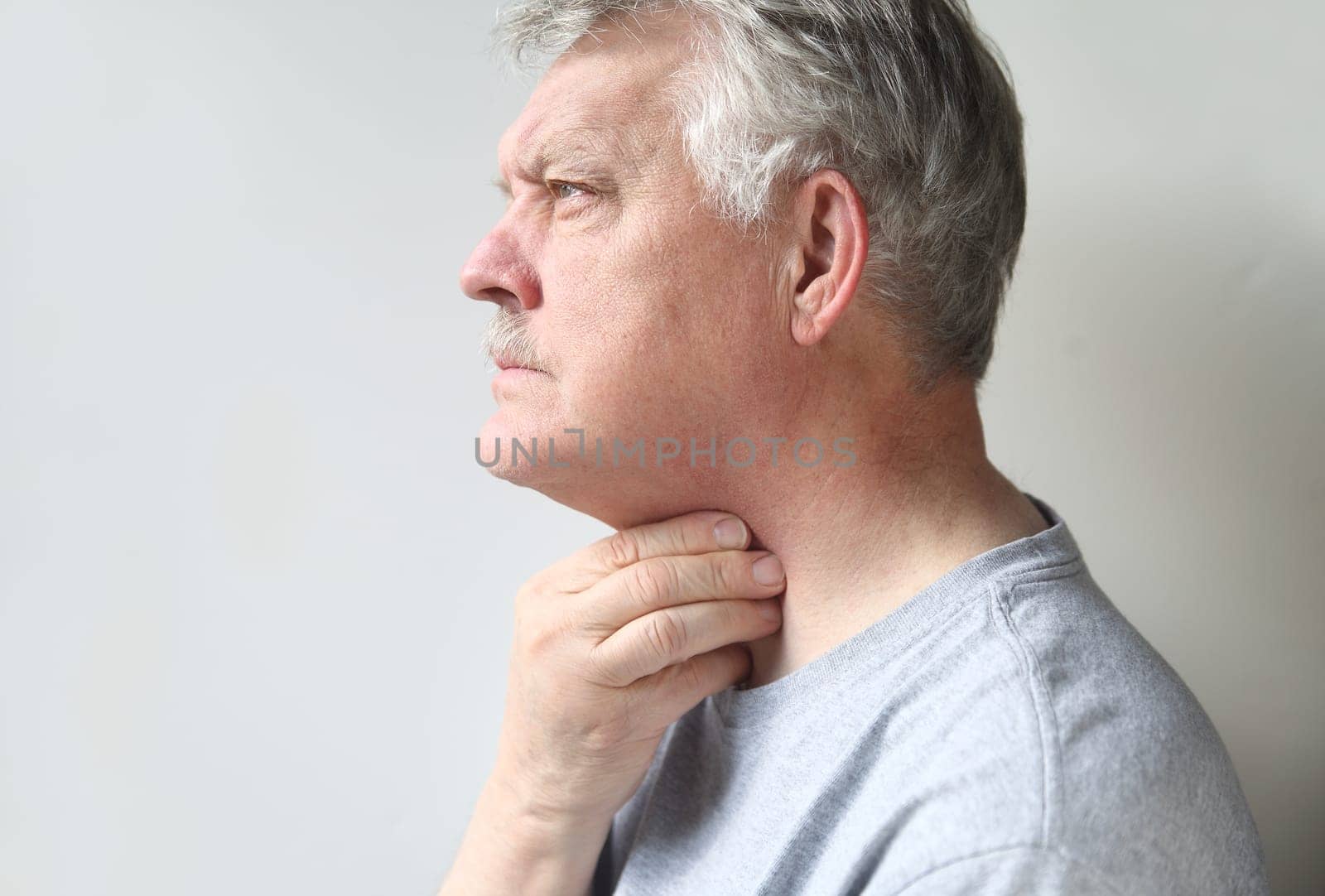 a senior is suffering from a sore throat