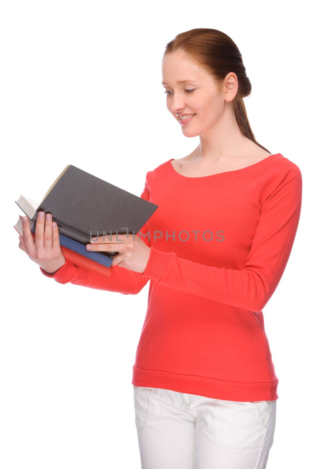 Studio shot of a young student with books