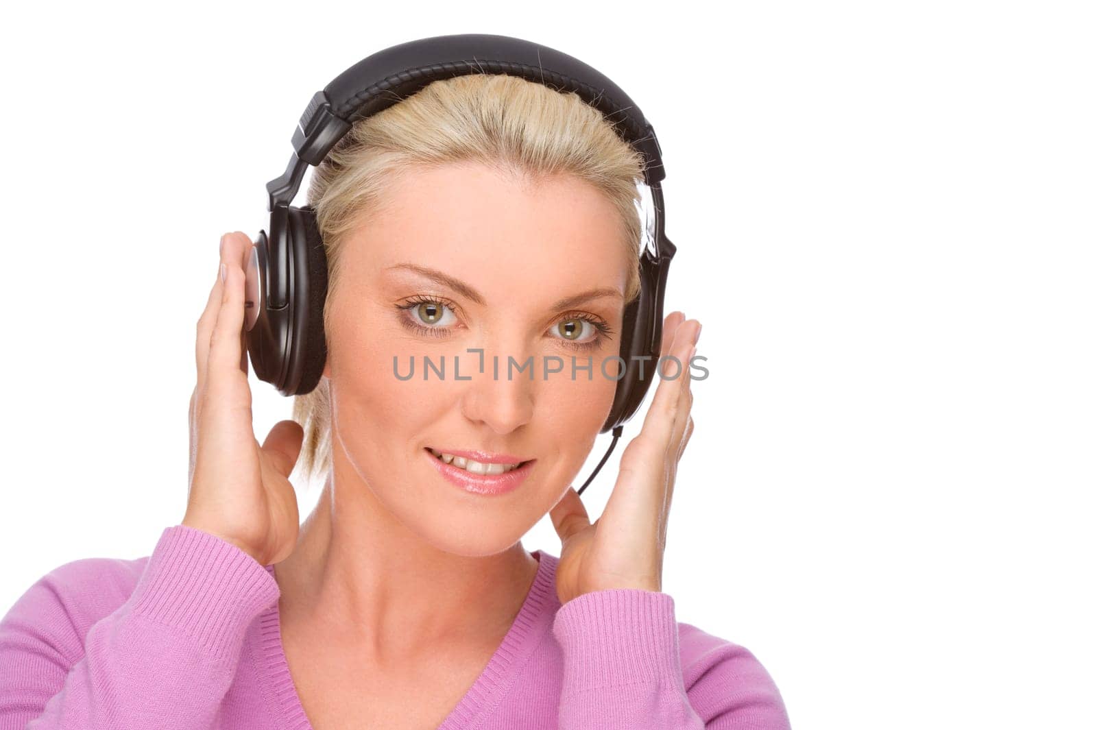 Studio shot of a young woman wearing headphones