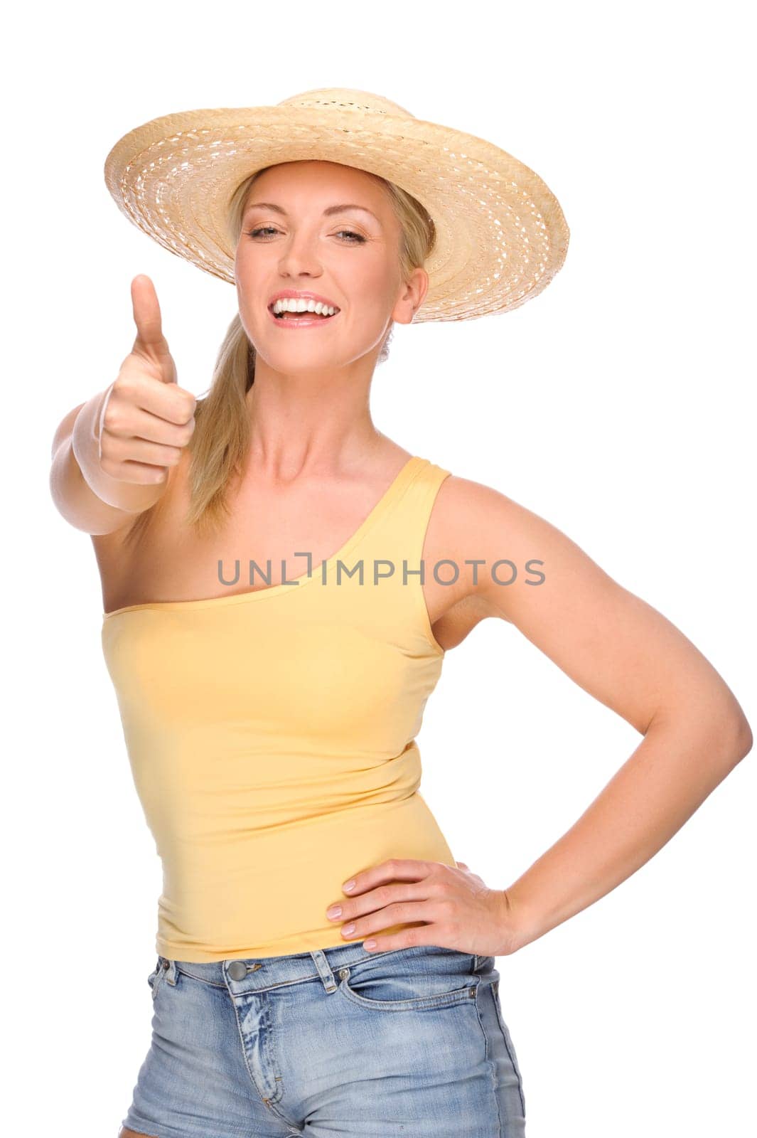 Studio shot of a young woman in a straw hat