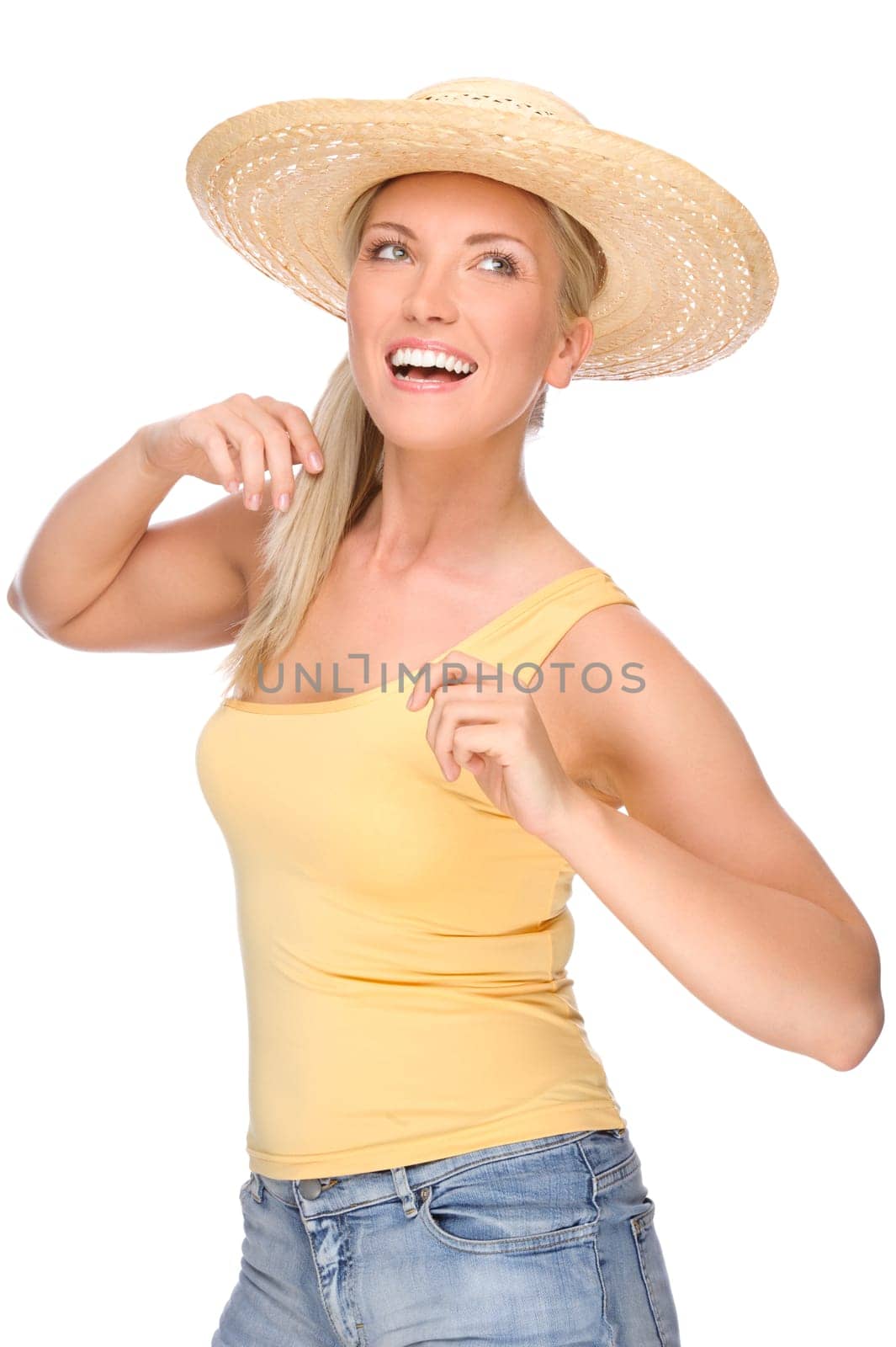 Studio shot of a young woman in a straw hat