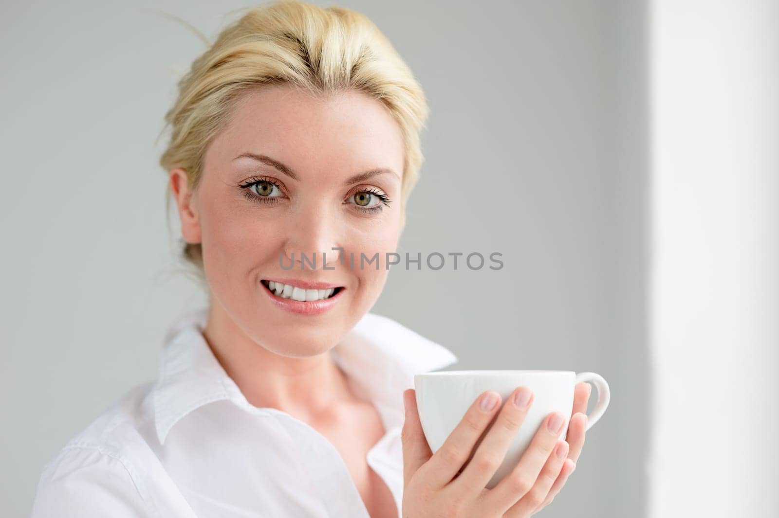 Young woman with a cup of coffee