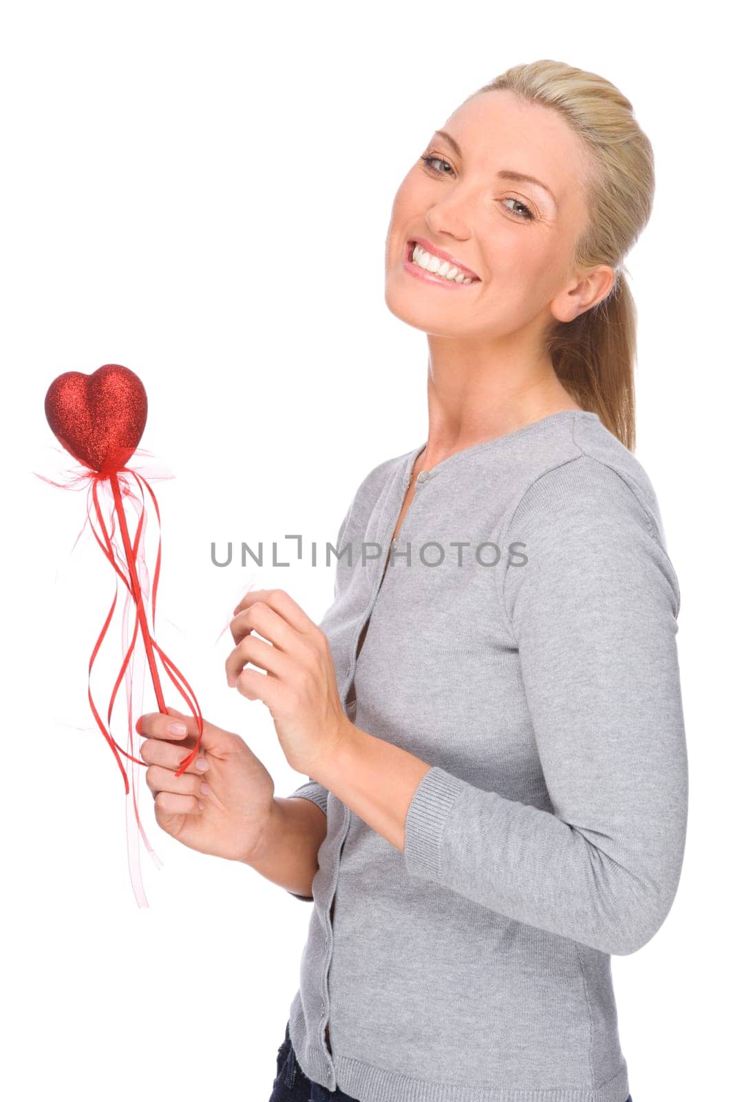 Studio shot of a young woman with a red heart