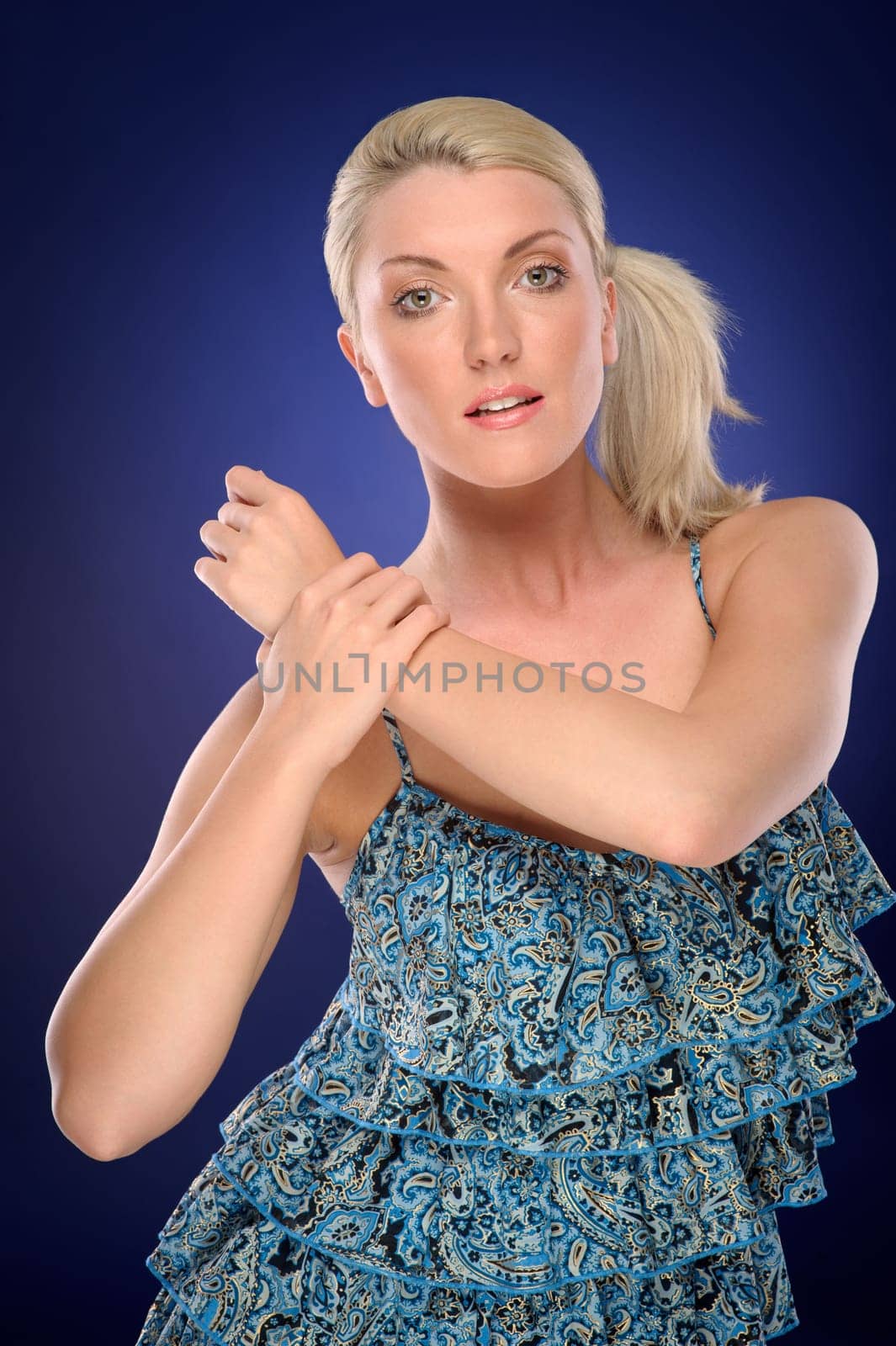 Studio shot of a young woman with a colored background