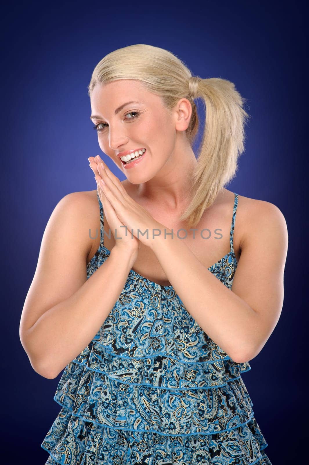 Studio shot of a young woman with a colored background