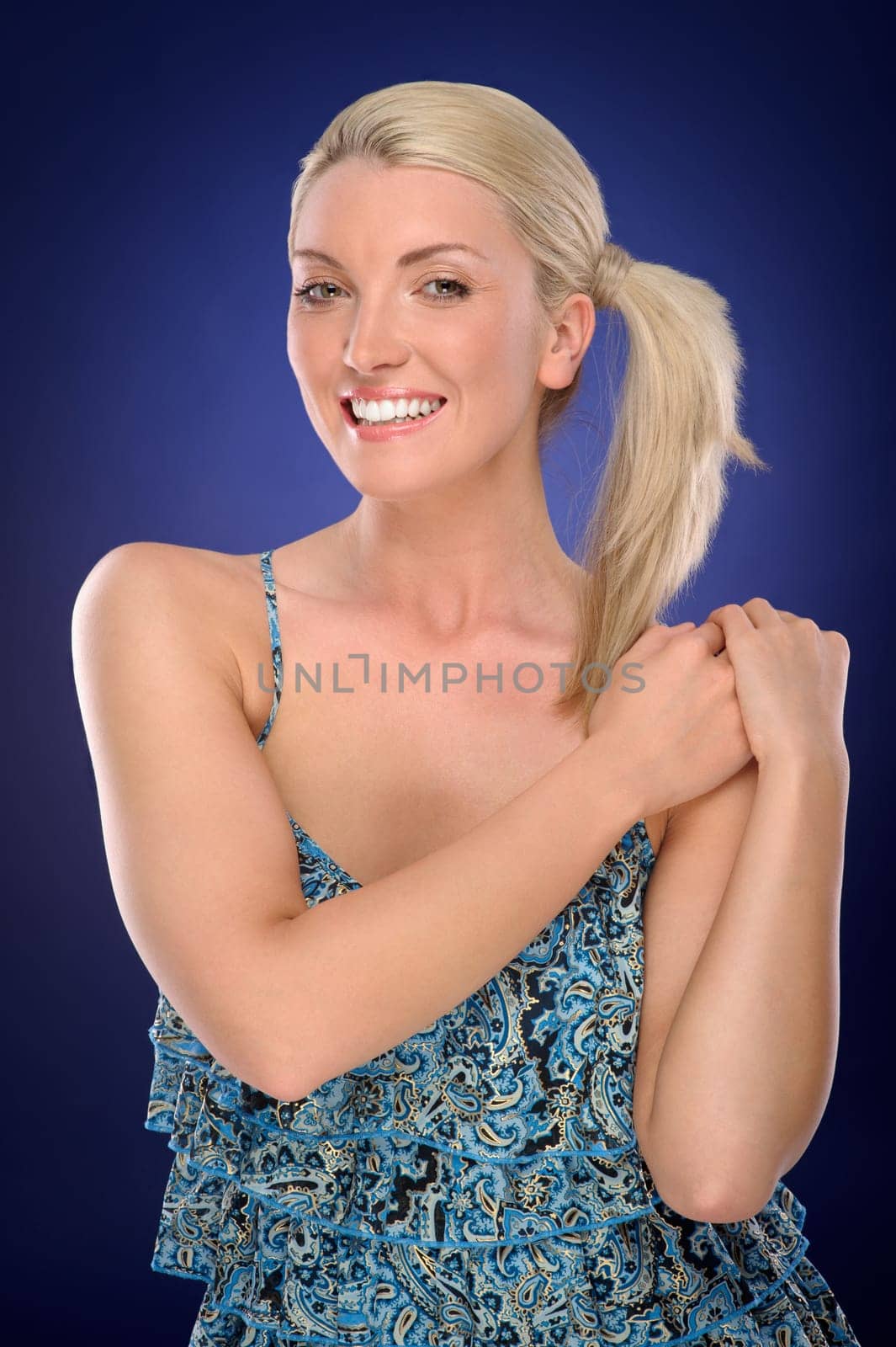Studio shot of a young woman with a colored background