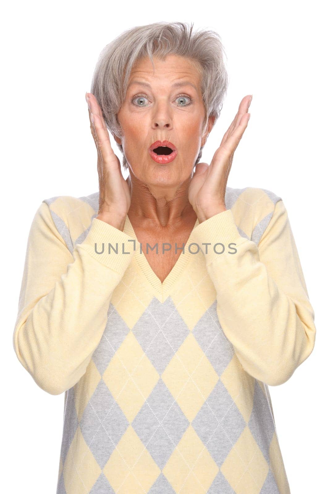 Studio shot of an active and happy senior woman