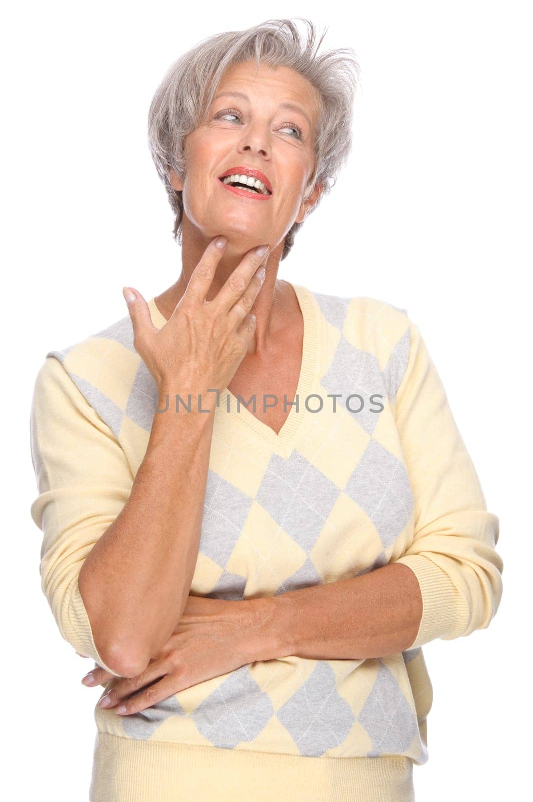 Studio shot of an active and happy senior woman
