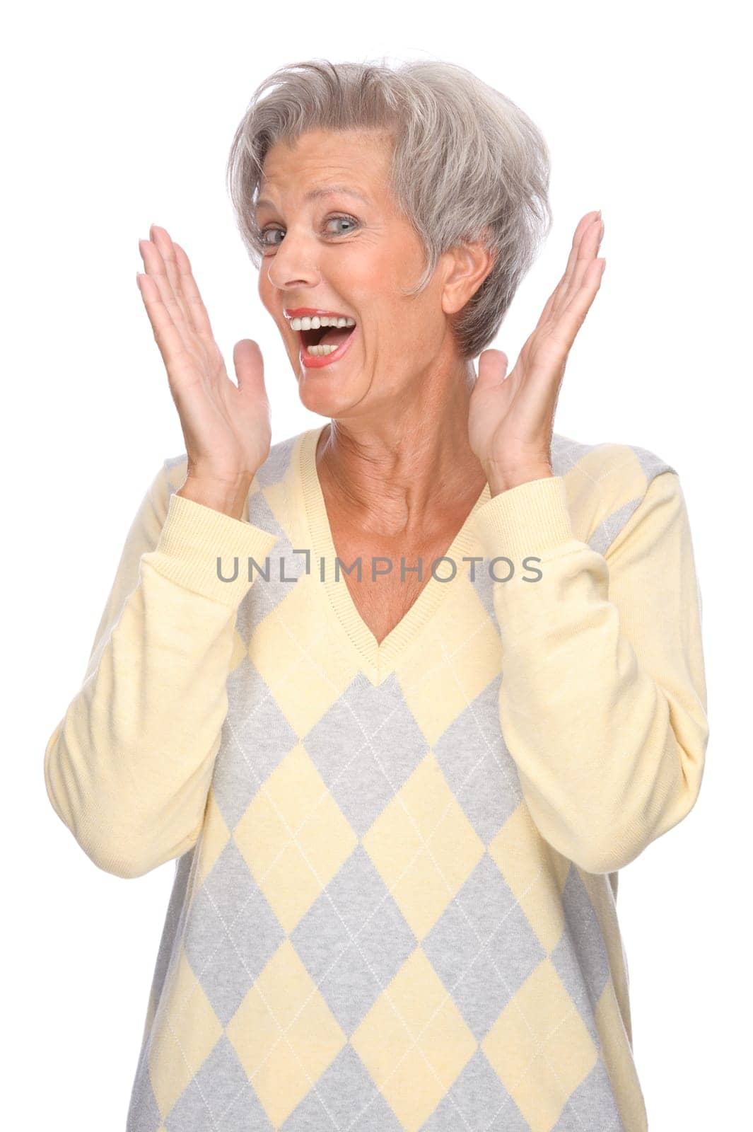 Studio shot of an active and happy senior woman