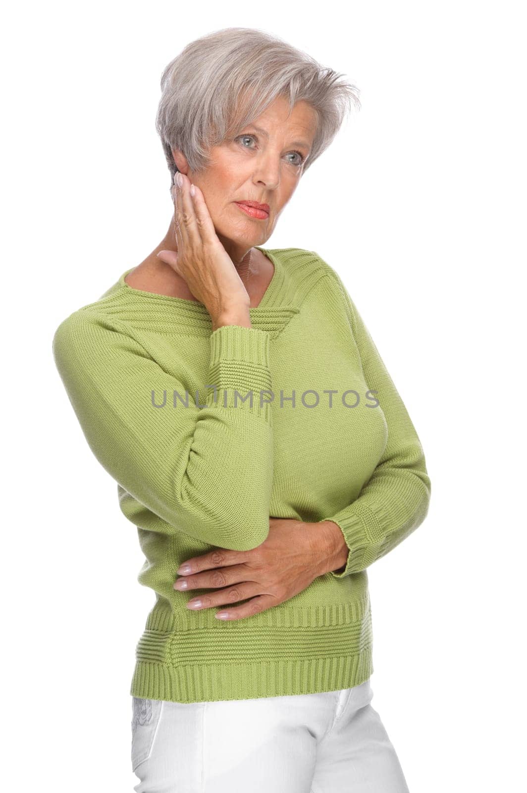 Studio shot of a thoughtful senior woman