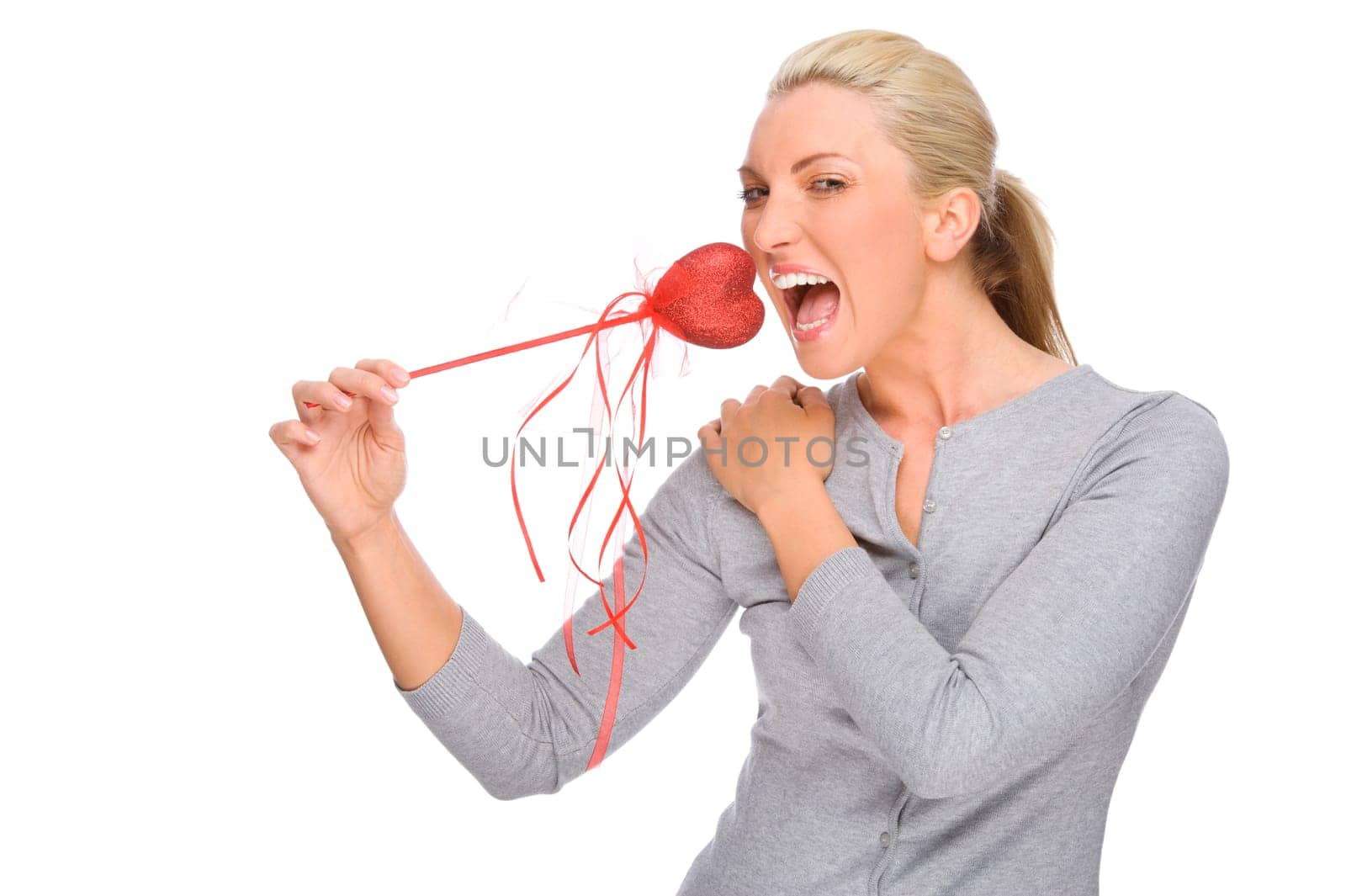 Studio shot of a young woman with a red heart