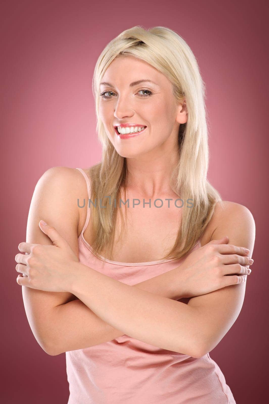Studio shot of a young woman with a colored background