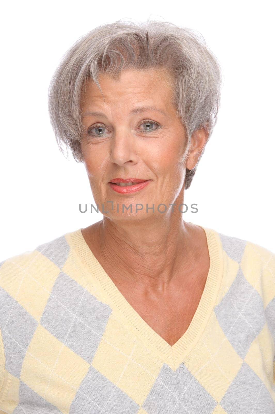 Studio shot of an active and happy senior woman