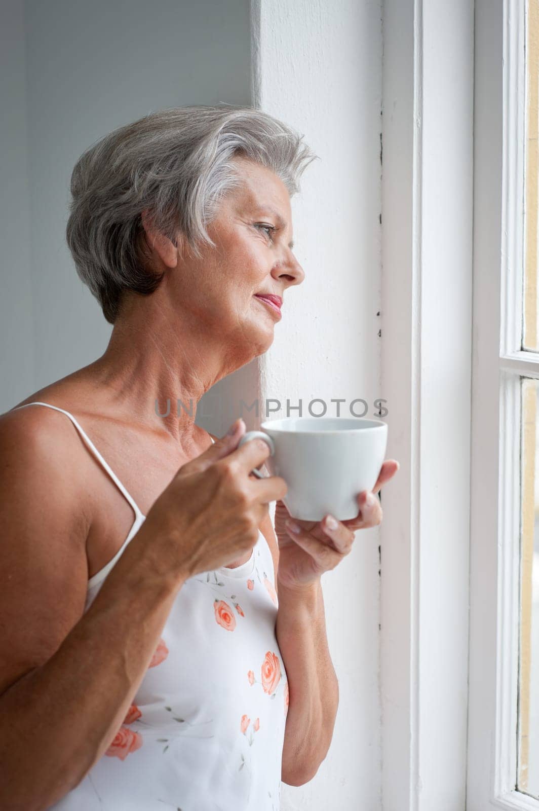 Active senior woman in the morning with a cup of coffee
