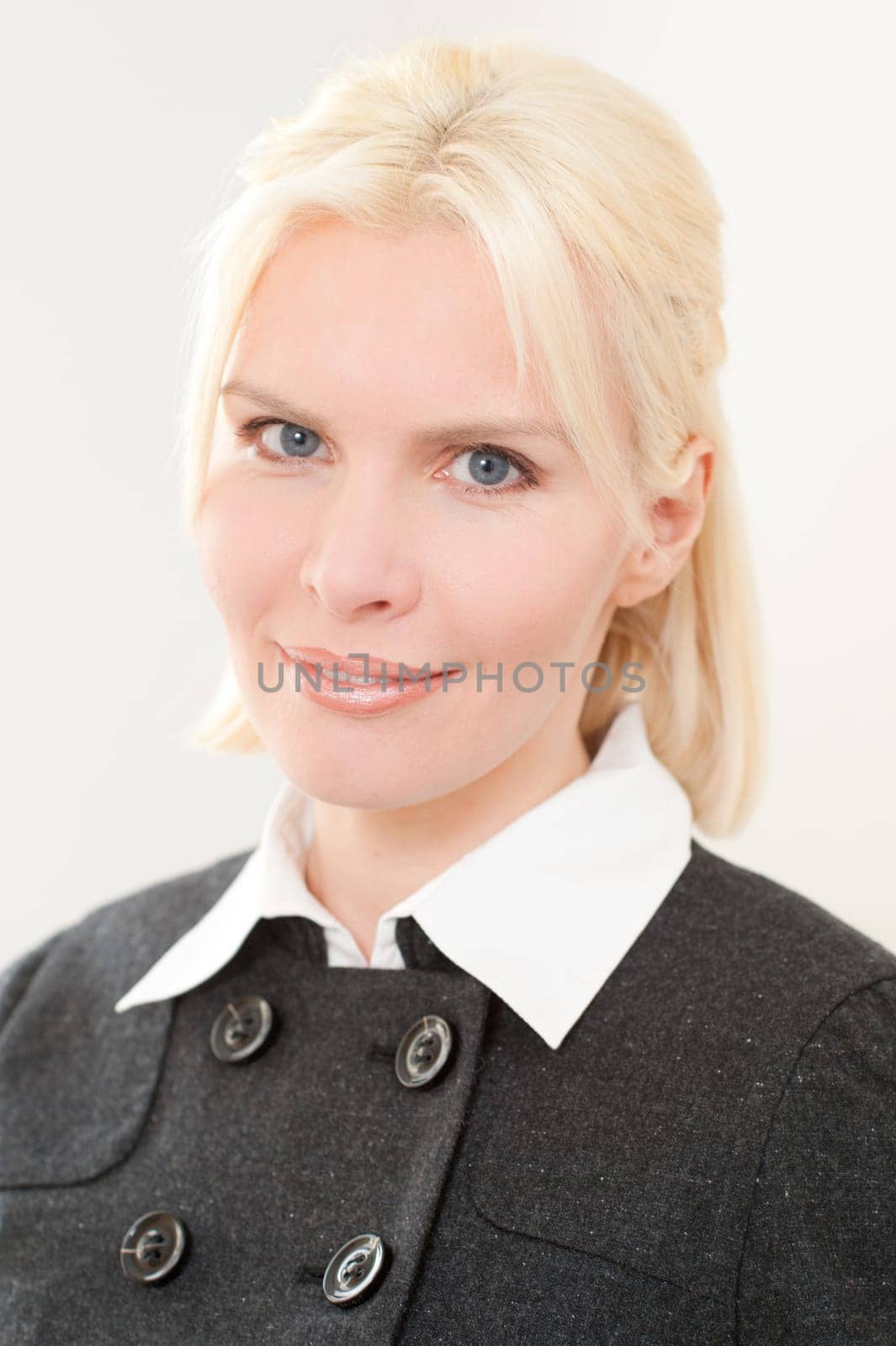 Portrait of a young and blonde businesswoman