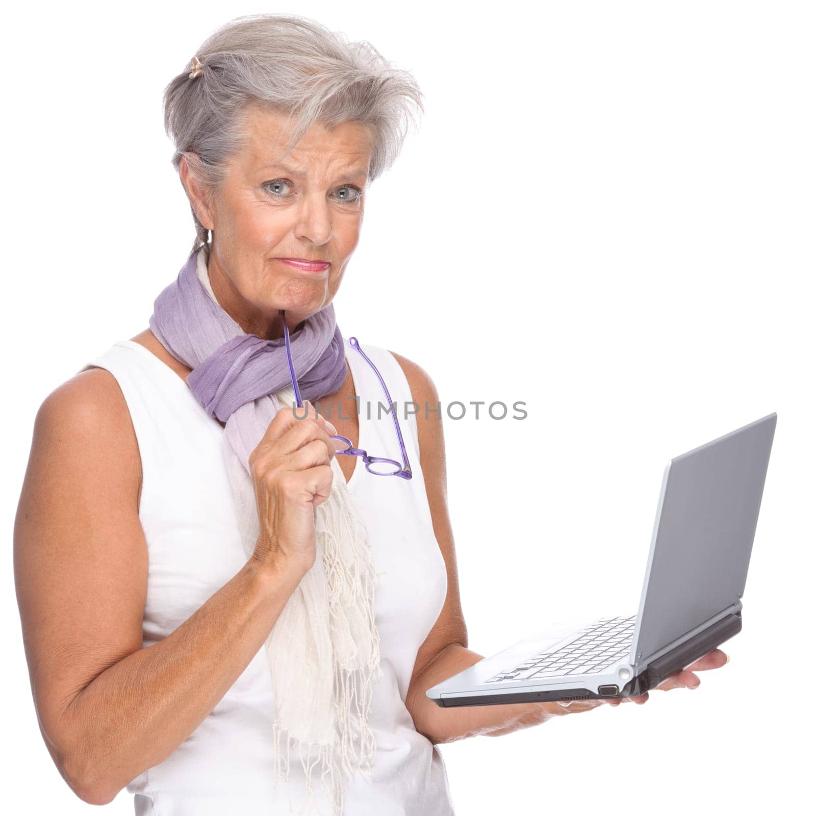 Studio shot of an active senior woman using a notebook
