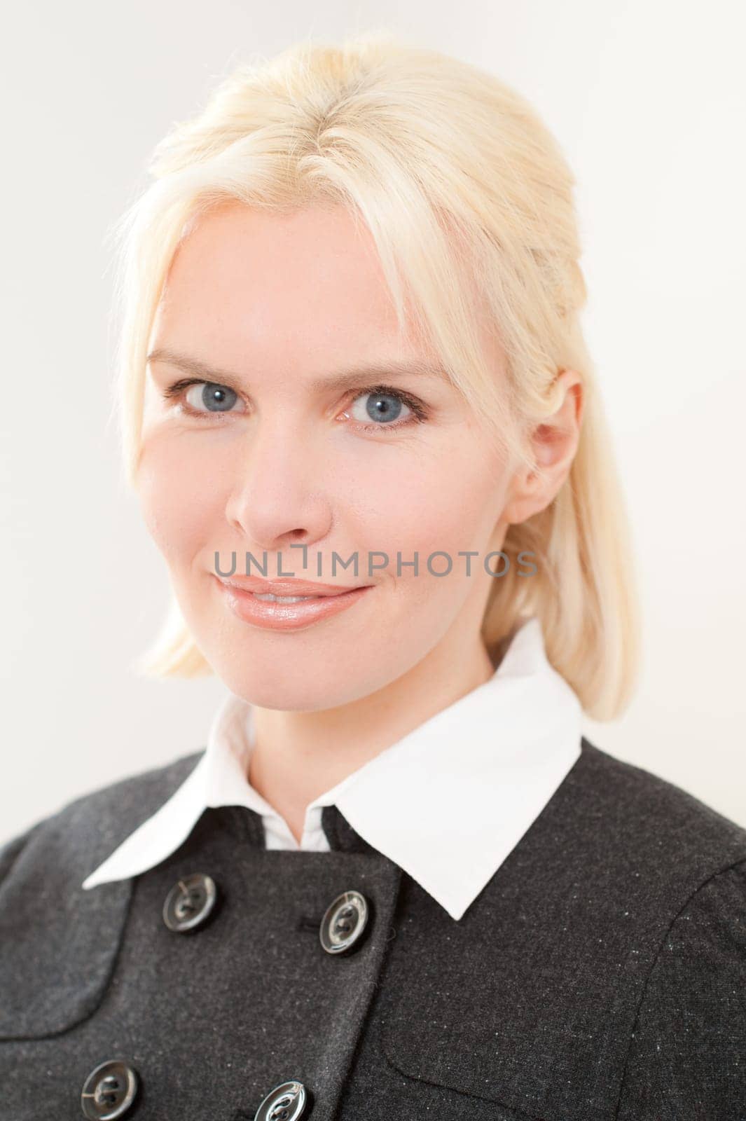 Portrait of a young and blonde businesswoman