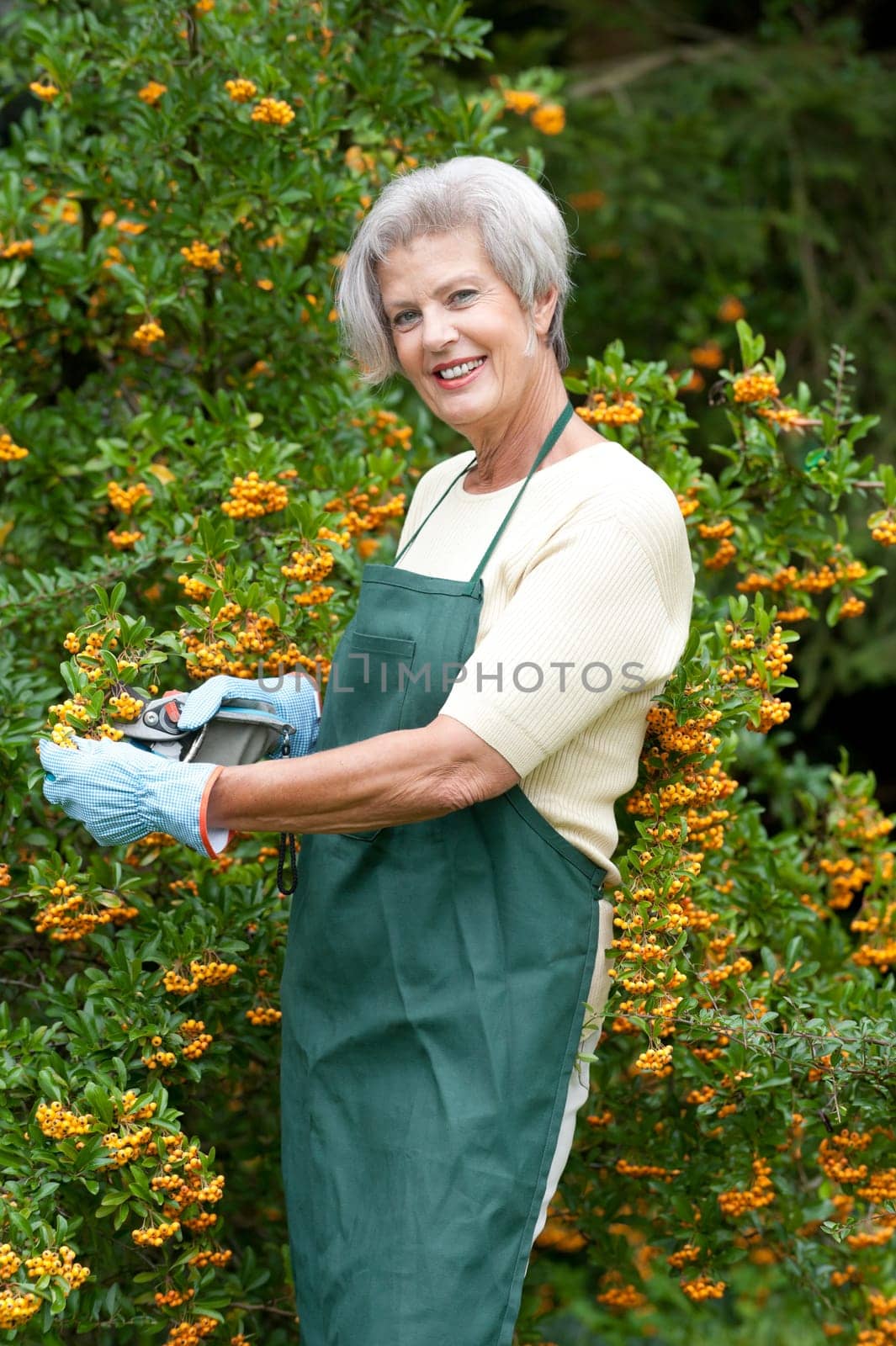 Active senior woman gardening