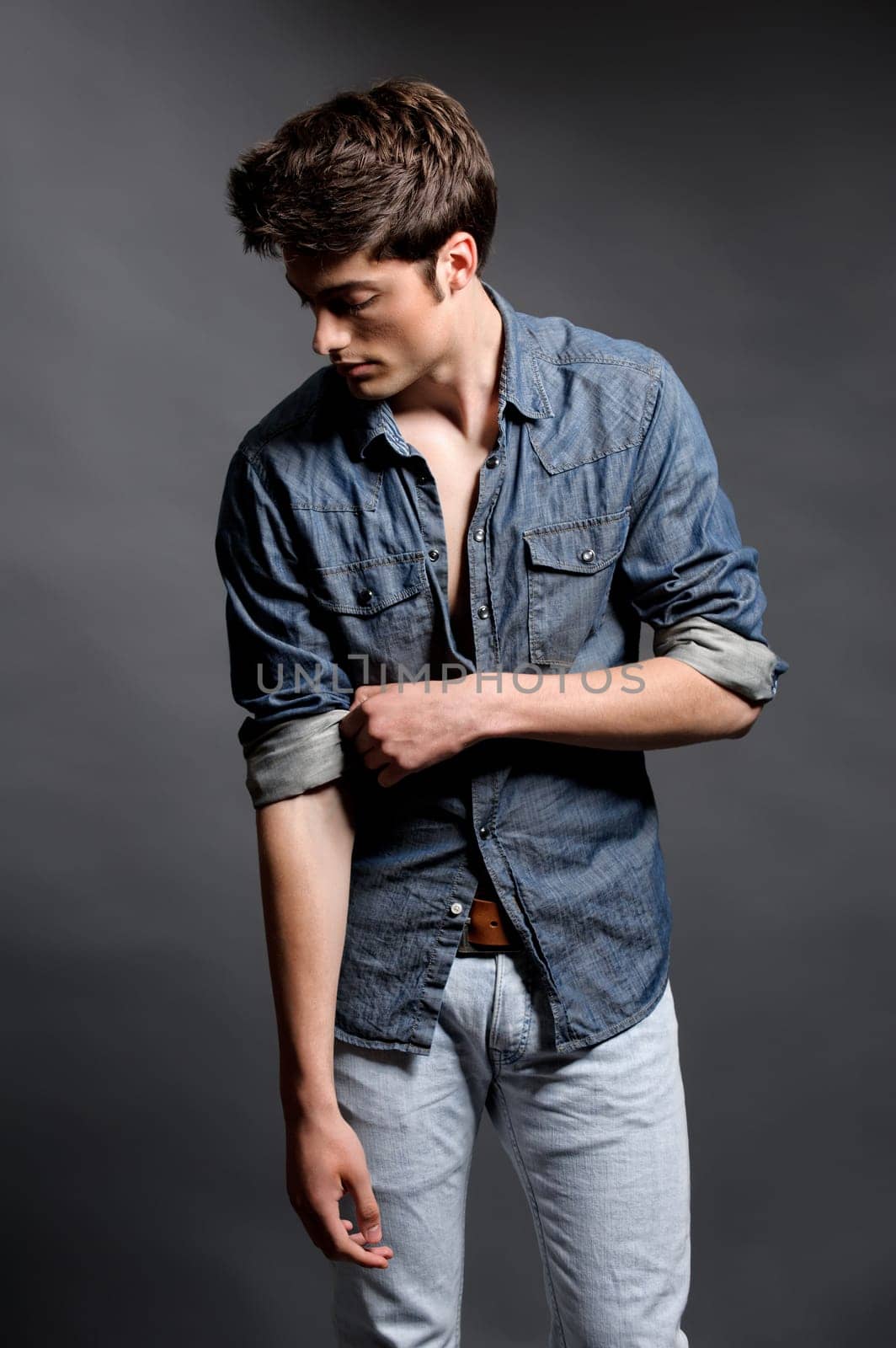 Fashion shot of a young man in the studio