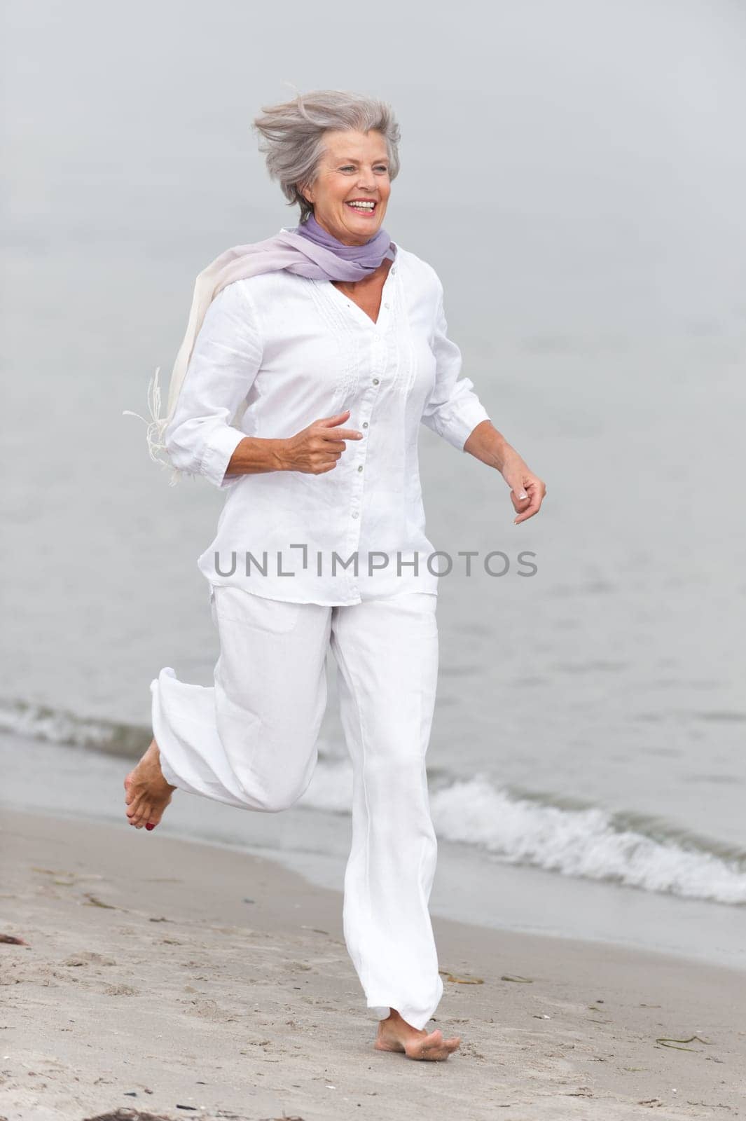 Active senior woman on the beach