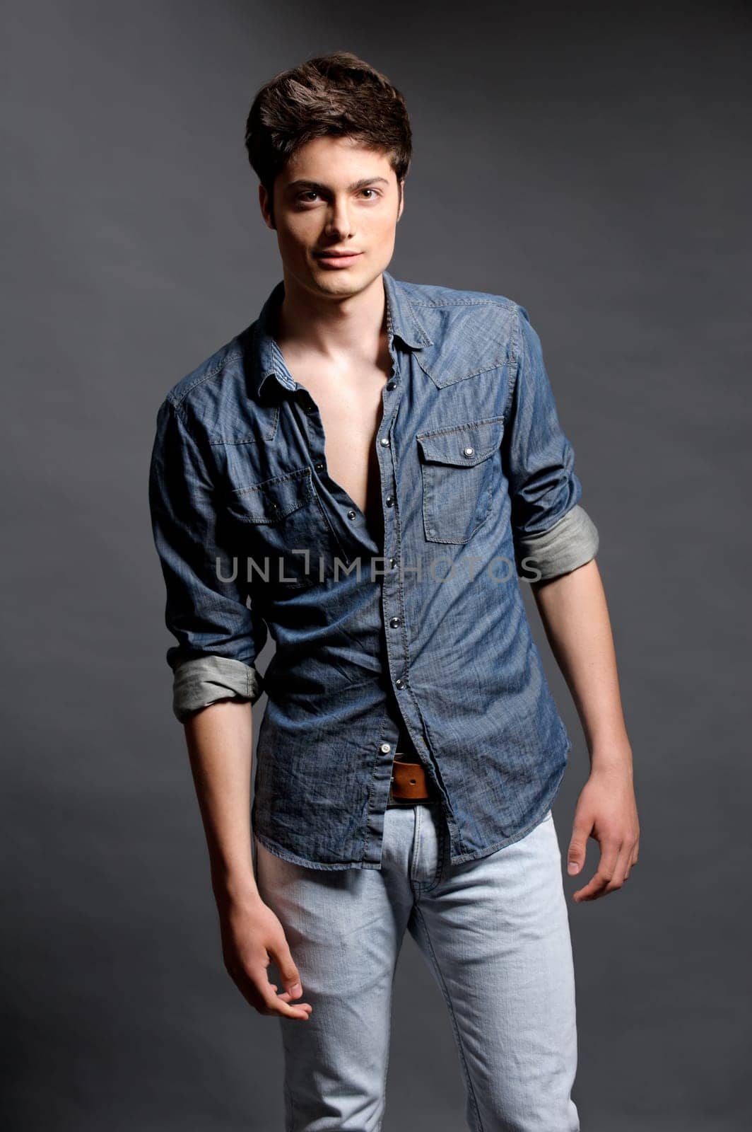 Fashion shot of a young man in the studio