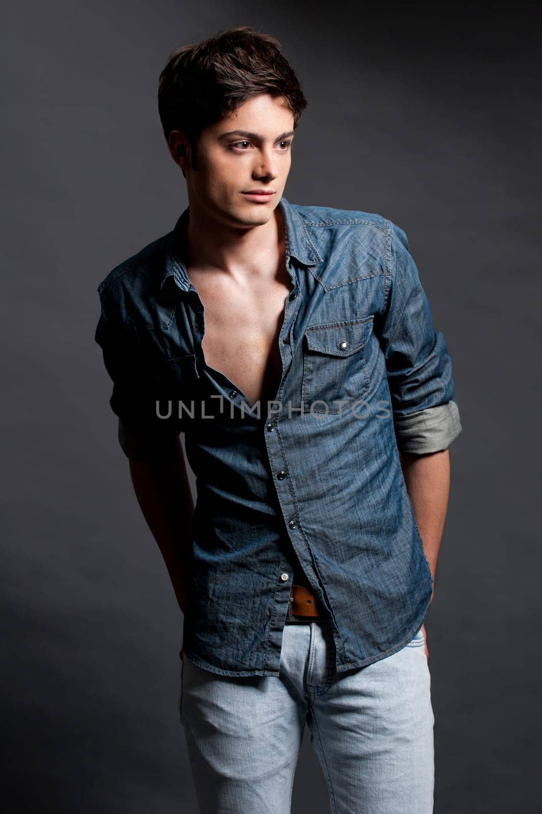 Fashion shot of a young man in the studio