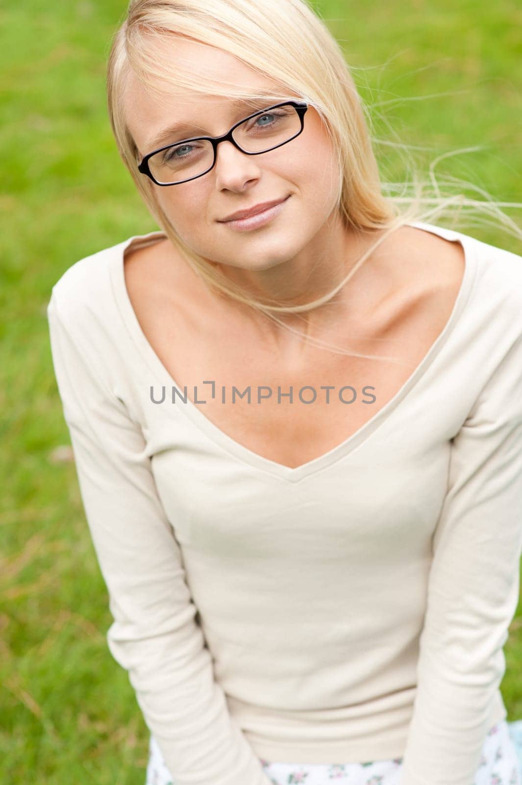 Portrait of a young and smiling woman in the park