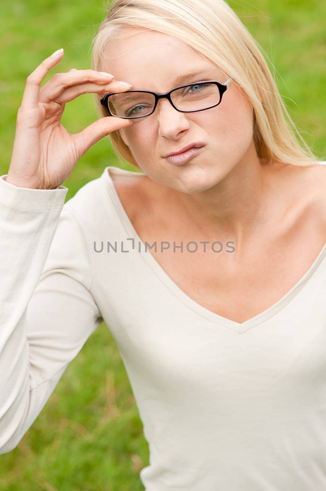 Portrait of a young and smiling woman in the park