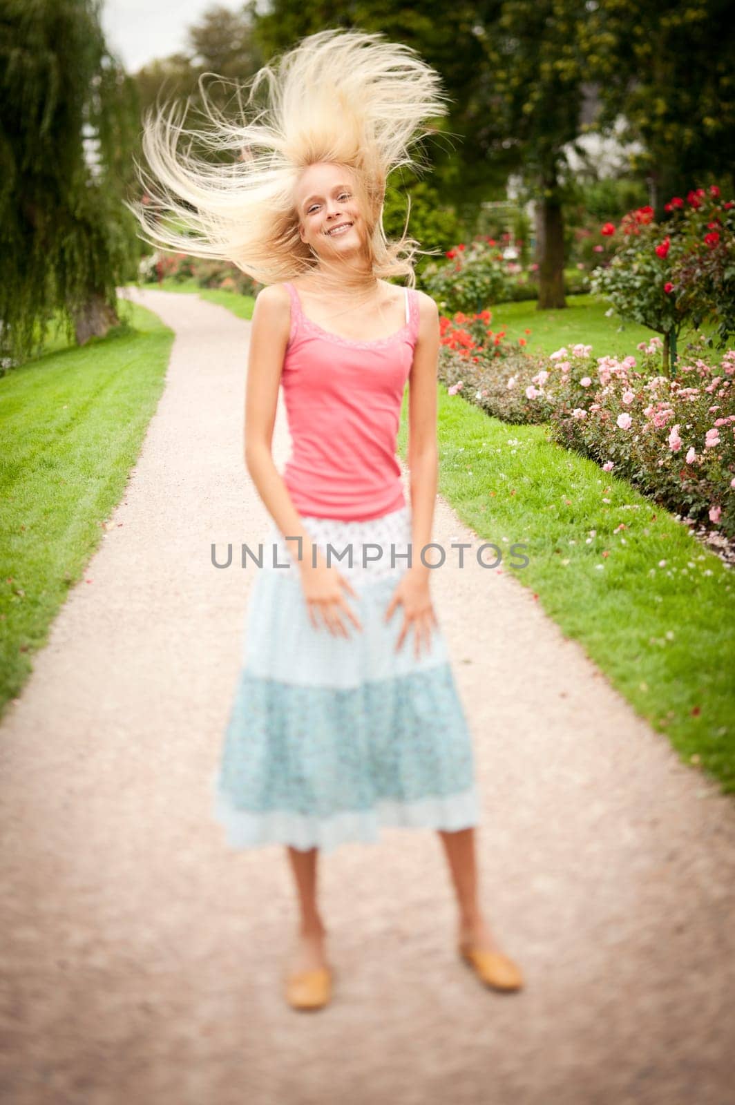 Portrait of a young and smiling woman in the park