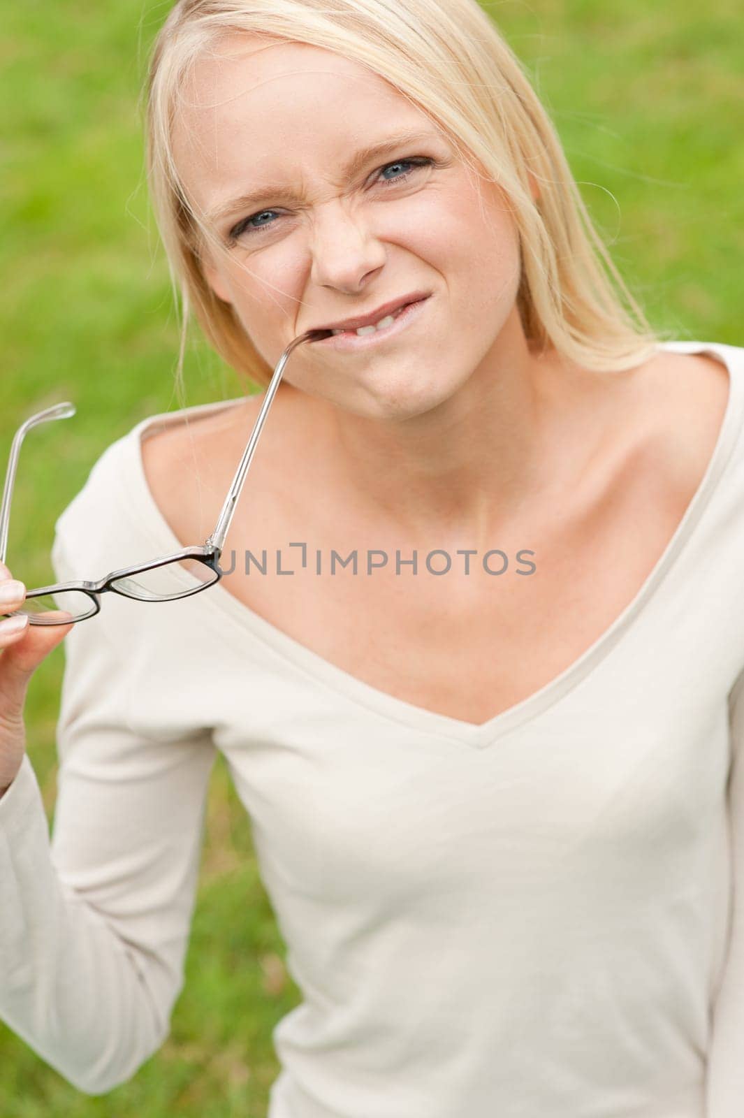 Portrait of a young and smiling woman in the park