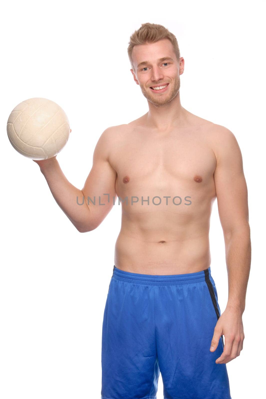 Studio shot of a young volleyball player against a white background