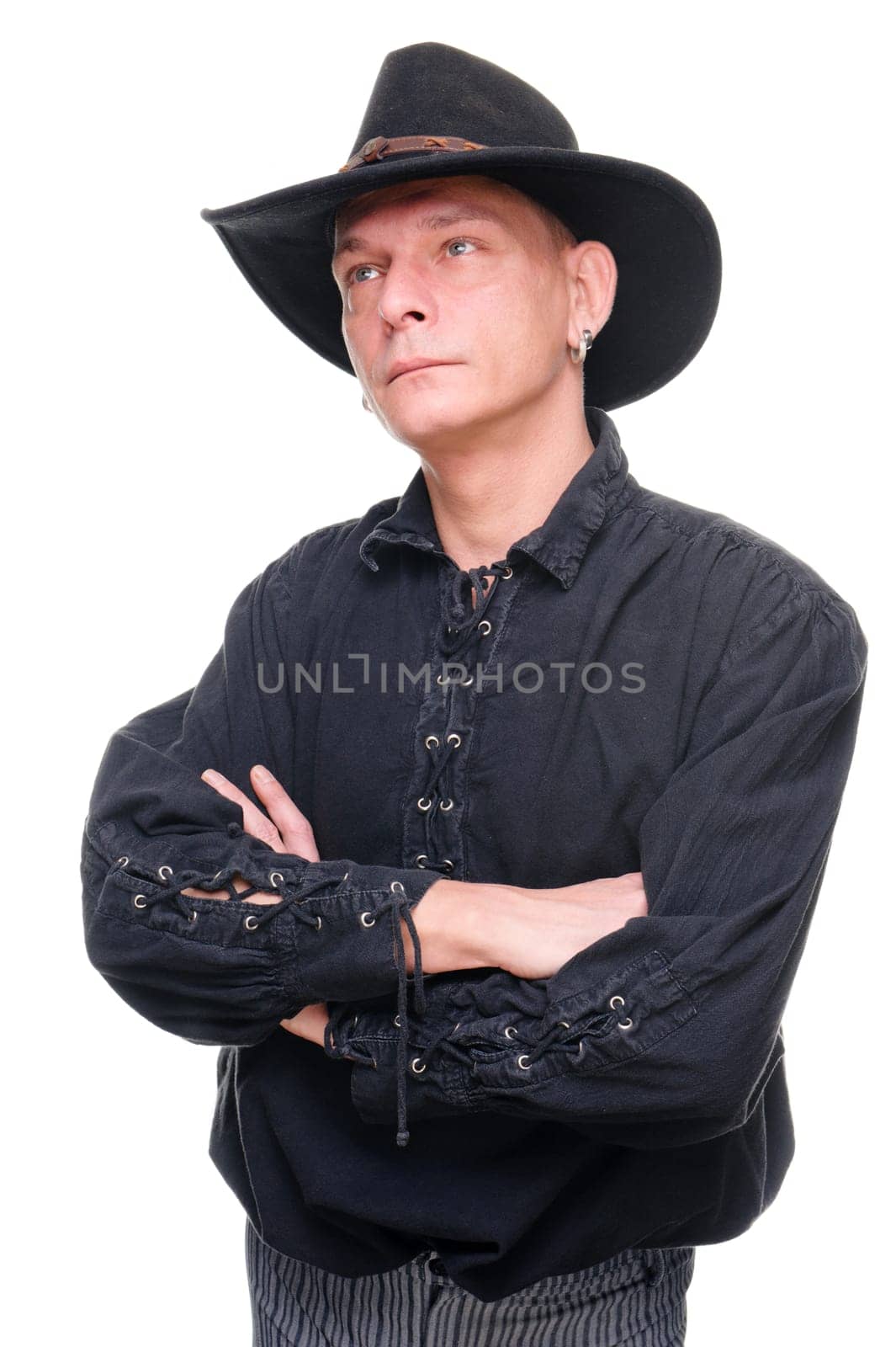 Man in western outfit against white background in studio